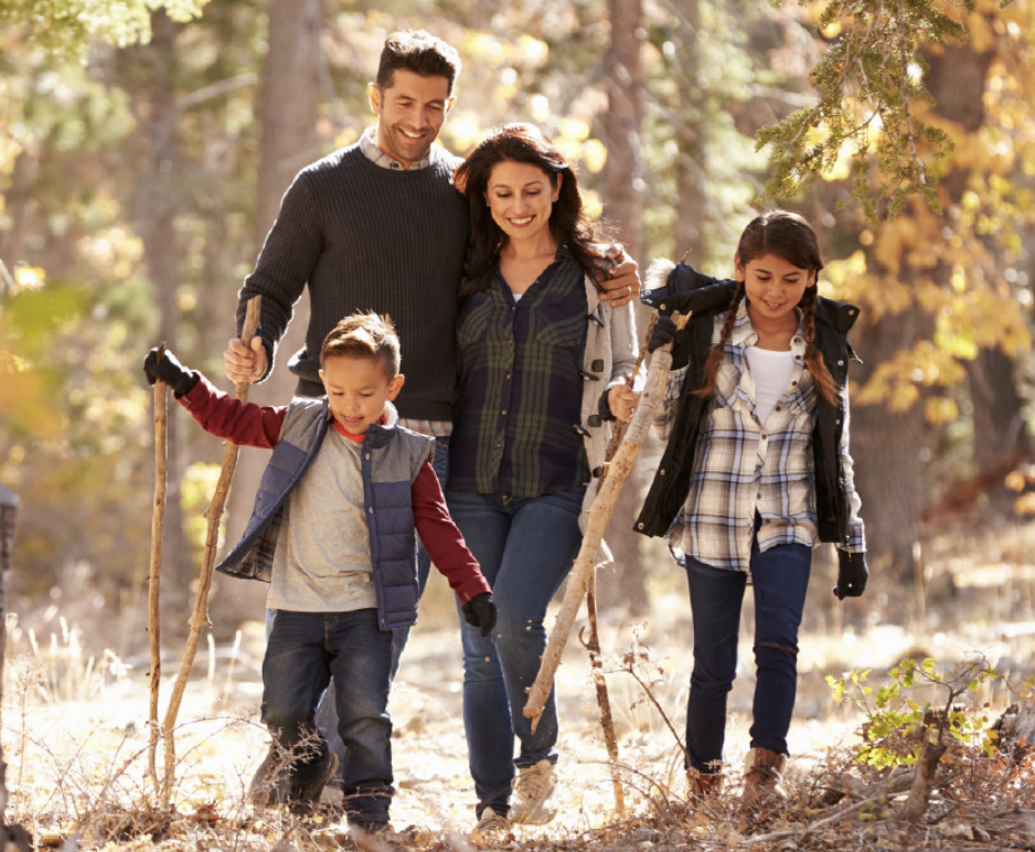 Family walking in fall woods