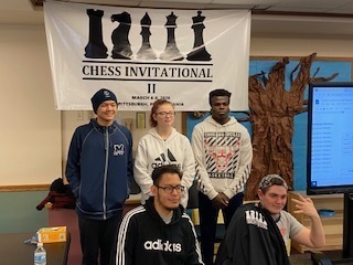 MSD team in front of Chess Invitational sign MSD team in front of Chess Invitational sign